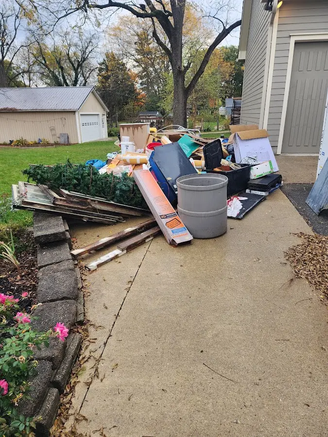 Dumpster being loaded with debris for 30 Yard Dumpster Rental in Vevay